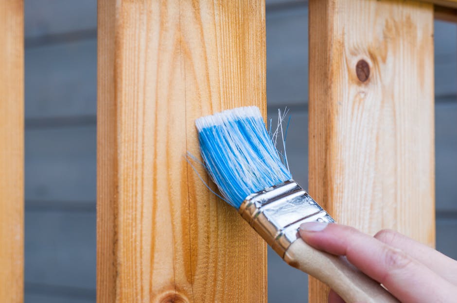 Image depicting a person checking for lead-based paint in a rental property