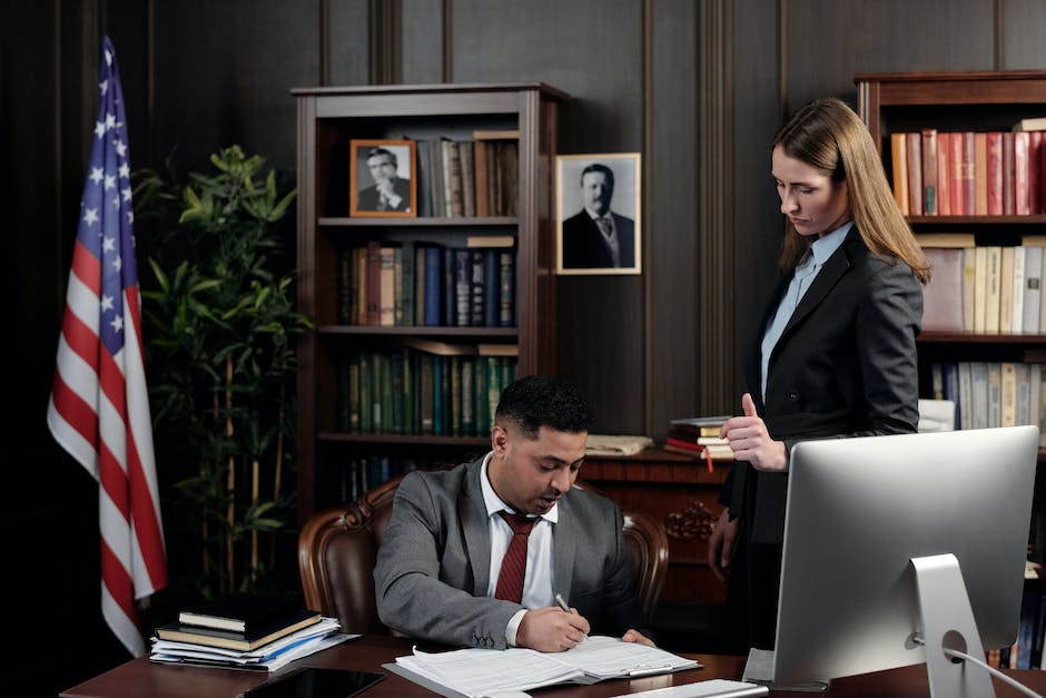 Image depicting a property manager reviewing tenant screening documents